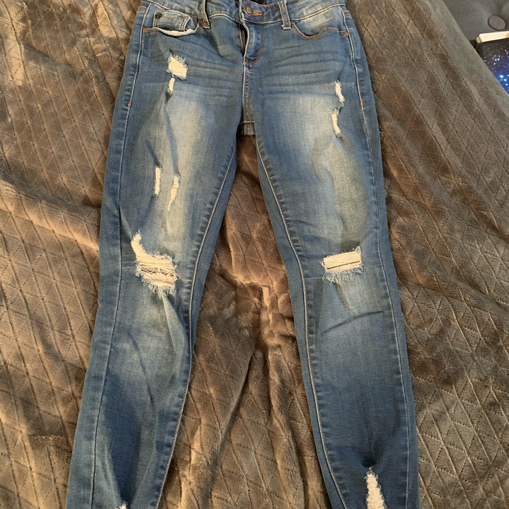 Blue skinny jeans with rips